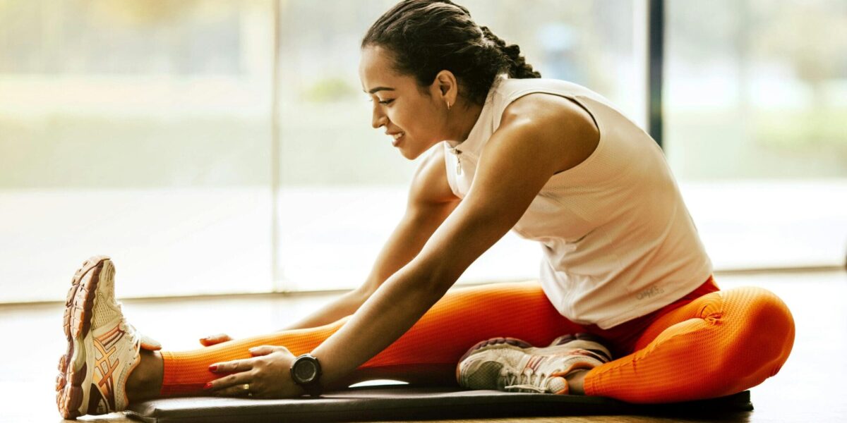 Woman Stretching Before Workout Exercise at Home Woman Stretching Before Workout Exercise at Home