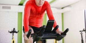 Man Exercising on Stationary Bike During a Home Workout